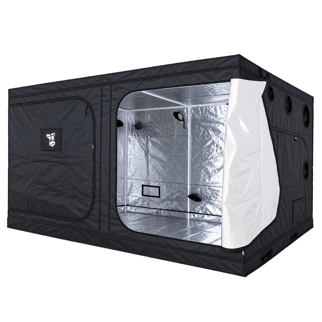 A black GorillaBox Deluxe grow tent measuring 4m-3m-2m with a reflective silver interior, shown with the front door partially open on the right. The tent features a small gorilla logo patch and ventilation holes on the side.