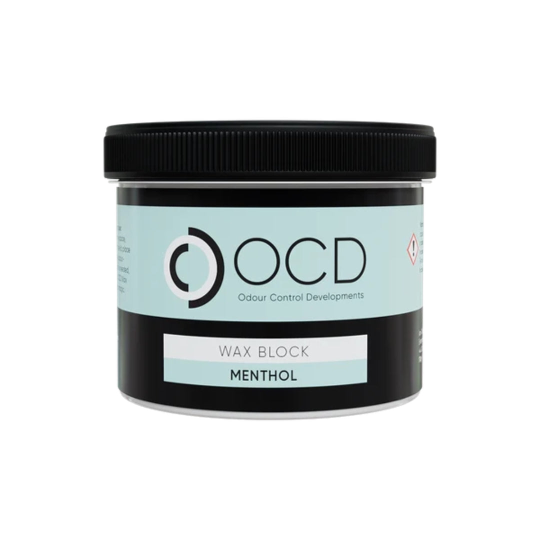 A jar of OCD Odour Control Developments Wax Block in the Menthol scent, featuring a black lid and a label with a light blue and black design.
