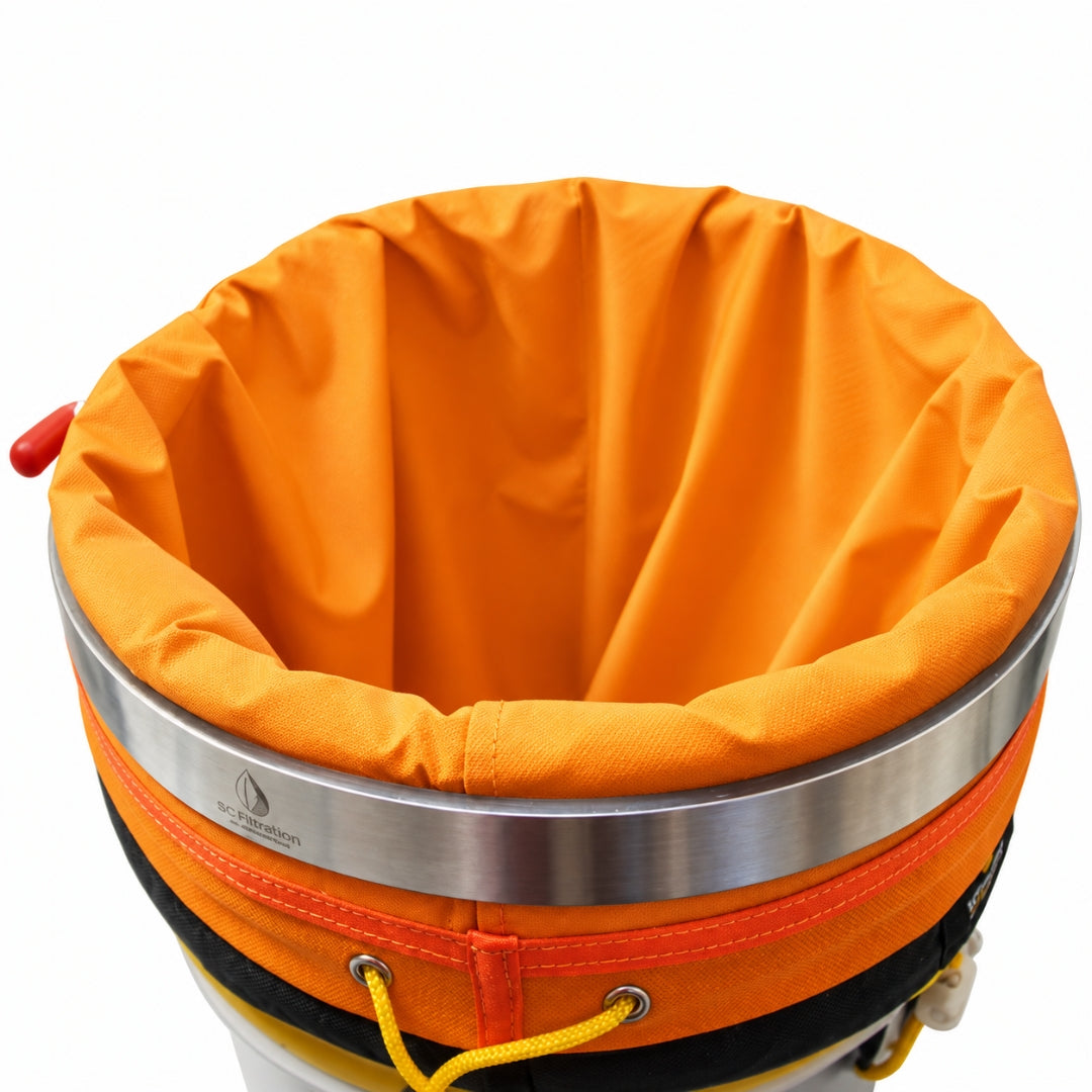 Close-up of an orange hash bag liner with a wide silver metal band, shown against a white background.