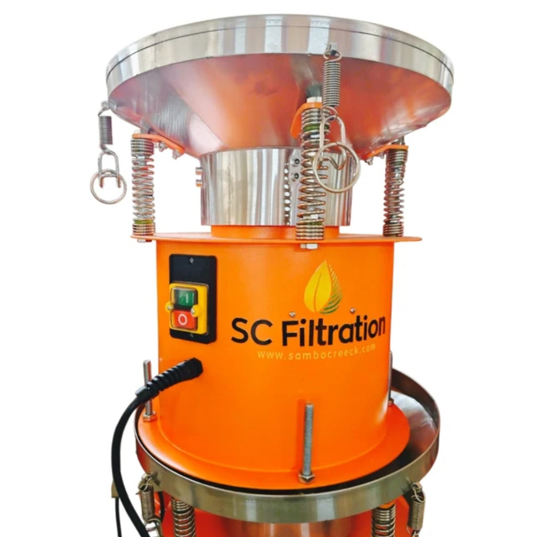 An orange and stainless steel industrial filtration machine with a control panel, springs, and a black power cord, branded with 'SC Filtration' on the side, set against a plain white background.