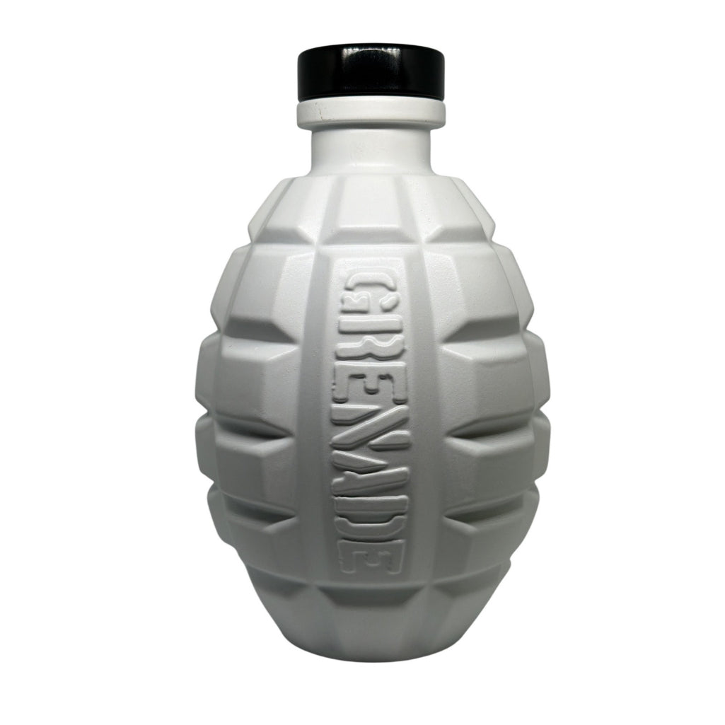 A white grenade-shaped bottle with a black cap, featuring the word 'GRENADE' embossed vertically on the front, set against a plain white background.