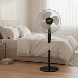 A black Ram pedestal fan with a circular wire mesh guard and three blades, shown against a plain white background.