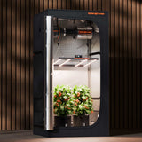 Spider Farmer indoor gardening system with plants on a wooden background