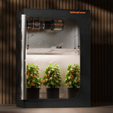 Spider Farmer SE4500 320w LED Grow Light indoor grow tent with plants inside on a wooden background