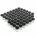 Clear glass jars with black lids arranged in a pattern on a white background