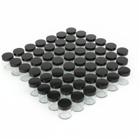 Clear glass jars with black lids arranged in a pattern on a white background