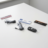 Three packaged black cross-connect cables on a white background: a Rhino Products cross-connect adapter, a Pack 36 gas cross-connect adapter, and a HyperFan v2 gas cross-connect adapter.