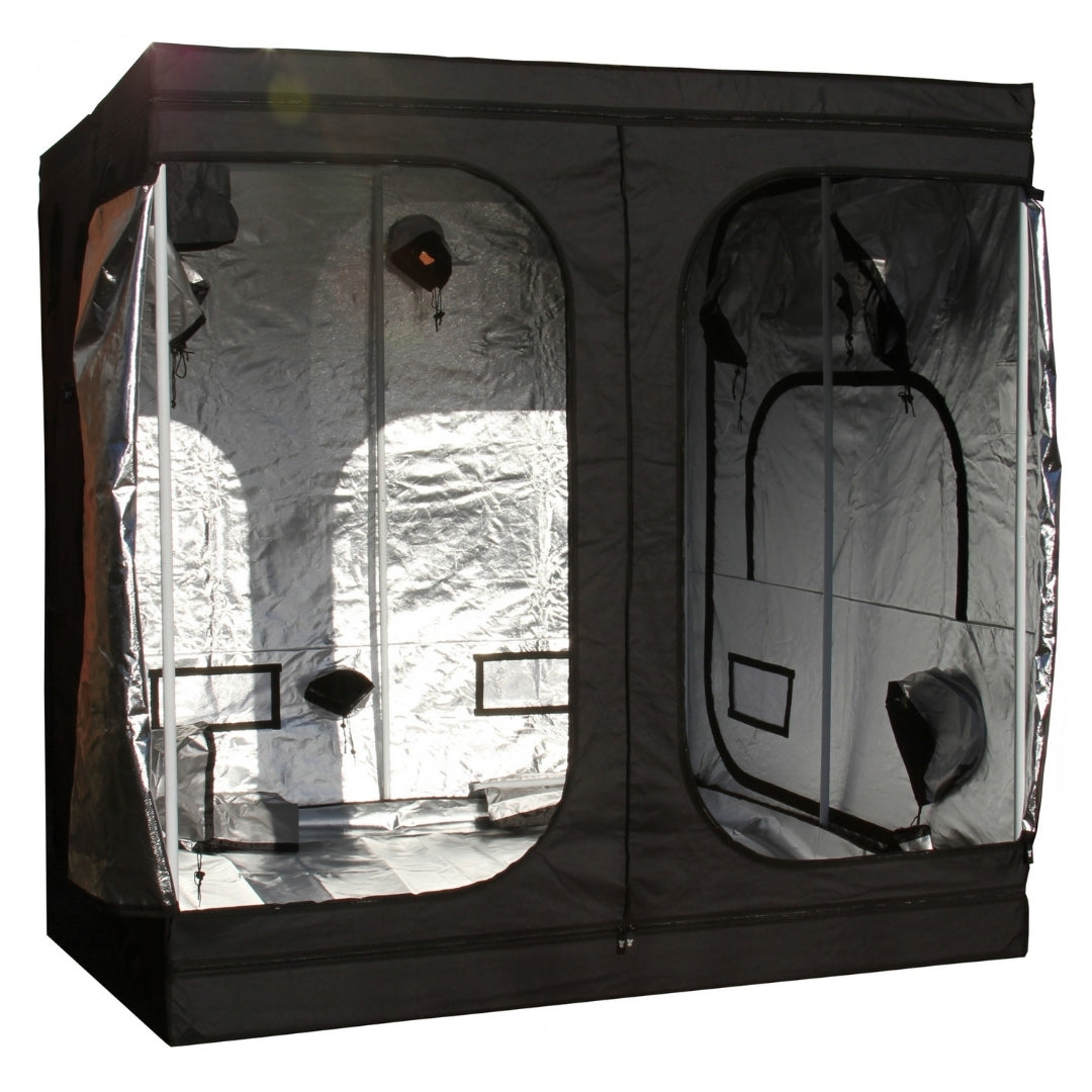 A black GorillaBox Deluxe grow tent measuring 2m-2m-2.2m with a reflective silver interior, shown with the front doors open. The tent features a small gorilla logo patch and ventilation holes on the side.