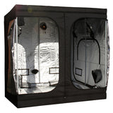 A black GorillaBox Deluxe grow tent measuring 2m-2m-2.2m with a reflective silver interior, shown with the front doors open. The tent features a small gorilla logo patch and ventilation holes on the side.