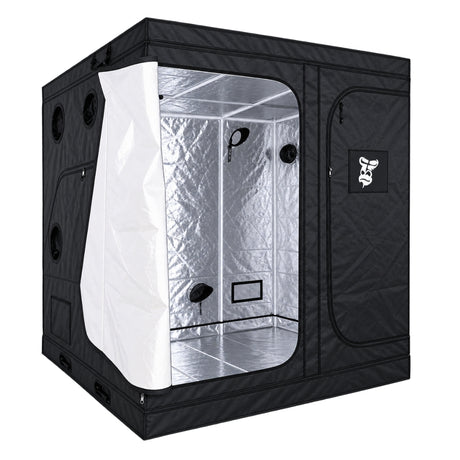 A black GorillaBox Deluxe grow tent measuring 2m-2m-2.2m with a reflective silver interior, shown with the front door partially open. The tent features a zippered side pocket with a small gorilla logo patch and ventilation holes on the side.