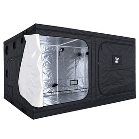 A black GorillaBox Deluxe grow tent measuring 4m-3m-2m with a reflective silver interior, shown with the front door partially open. The tent features a zippered side pocket with a small gorilla logo patch and ventilation holes on the side.