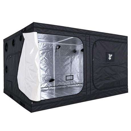A black GorillaBox Deluxe grow tent measuring 4m-3m-2m with a reflective silver interior, shown with the front door partially open. The tent features a zippered side pocket with a small gorilla logo patch and ventilation holes on the side.