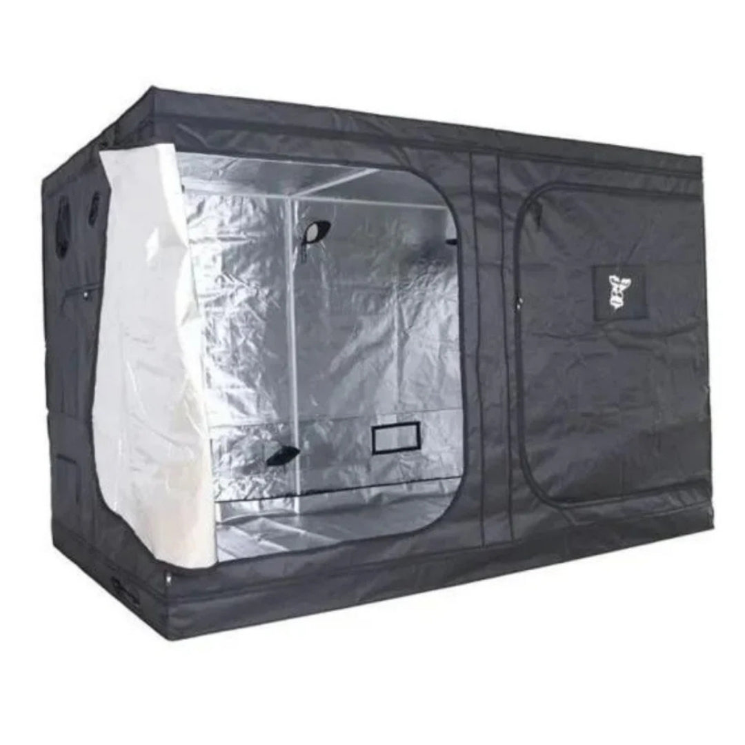 A black GorillaBox Deluxe grow tent measuring 5m-4m-2.2m with a reflective silver interior lining, shown partially open with a door panel pulled out on the left. The tent features a zippered door and a small gorilla logo patch on the front.