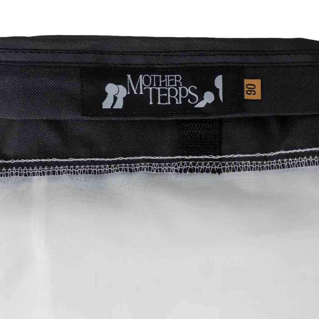 Close-up of the of black Mother Terps bubble bag, showing the black brand label with white text and a small brown size tag marked '90'.