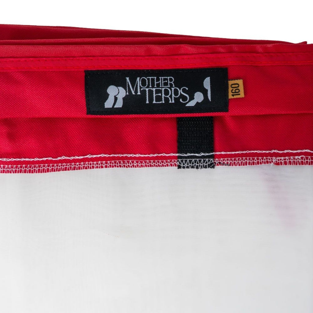 Close-up of a red Mother Terps bubble bag product with a black brand label and a small yellow size tag reading 160, shown against a white background.
