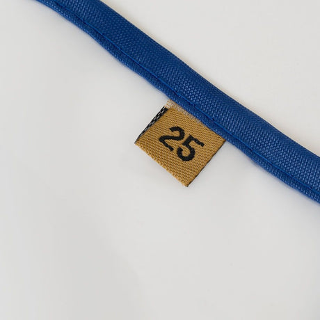 Close-up of a Mother Terps screen with a brown label displaying the number 25 on a white background.