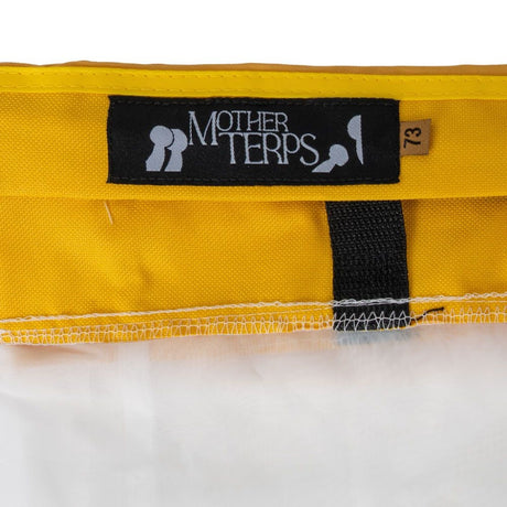 Close-up of a yellow Mother Terps Bubble Bag with a black Mother Terps brand label and a small size tag reading 73, shown against a white background.