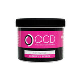 A black plastic jar of OCD Odour Control Developments 'Wax Block' in the 'Cherries & Berries' scent, featuring a vibrant pink label on a white background.