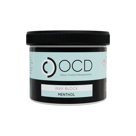 A jar of OCD Odour Control Developments Wax Block in the Menthol scent, featuring a black lid and a label with a light blue and black design.