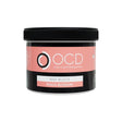 A black plastic jar of OCD Odour Control Developments Wax Block in the scent 'Peach Blossom', featuring a pink and white label on a white background.