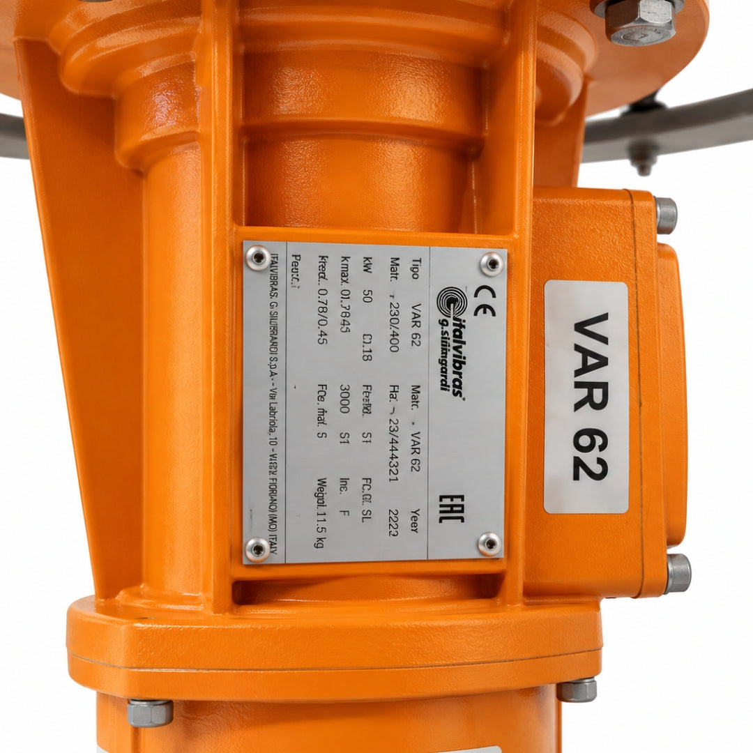 Close-up of an orange industrial motor housing with a metal specification plate and a white VAR 62 label, photographed on a white background.