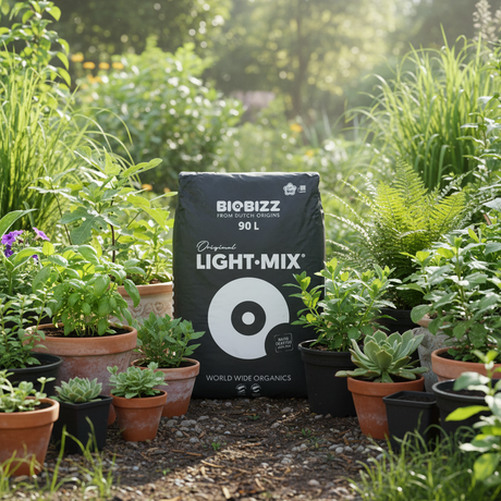 A 90 L bag of BIOBIZZ Original Light-Mix garden soil mix is displayed in a lush, sunlit garden surrounded by potted plants.