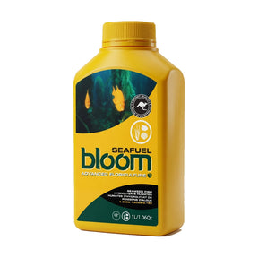 A yellow bottle of Seafuel Bloom Advanced Floriculture seaweed extract, featuring a dark green and black label with a kangaroo logo, on a white background.