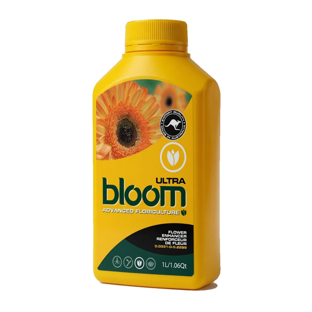 A yellow bottle of bloom Ultra Advanced Floriculture flower enhancer, featuring a dahlia graphic on the label, set against a plain white background.