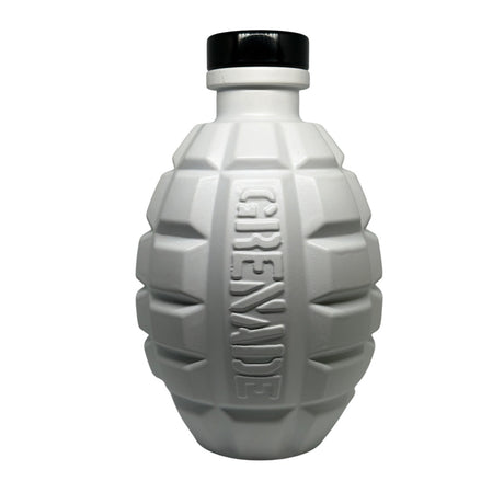 A white grenade-shaped bottle with a black cap, featuring the word 'GRENADE' embossed vertically on the front, set against a plain white background.
