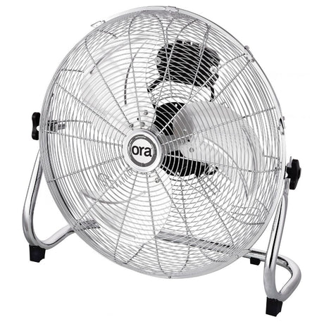 A silver Ora metal floor fan with a wire safety grille, chrome stand, and black accents, featuring the 'ora' brand logo in the center.