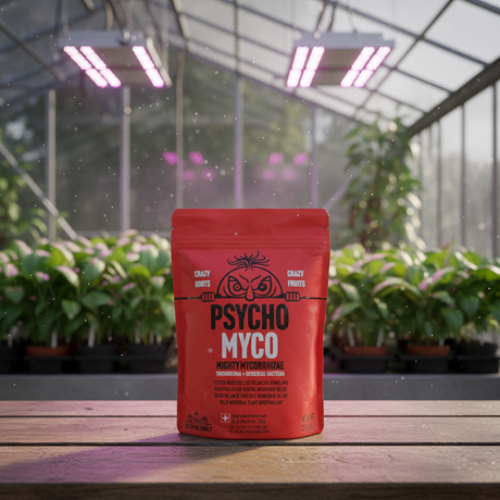 Red package labeled 'Psycho Myco' on a wooden surface with plants in the background